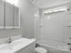 Bathroom featuring a single vanity, bathtub with shower, and white fixtures at 233 Proctor St, Gastonia, NC 28052
