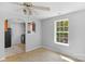 Dining room with a view of the kitchen area and a large window at 233 Proctor St, Gastonia, NC 28052