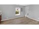 Neutral room boasts natural lighting through window, and a view to the outdoors at 233 Proctor St, Gastonia, NC 28052