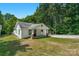 Exterior view of this single Gathering home with a grassy front yard and quaint porch at 233 Proctor St, Gastonia, NC 28052