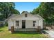Charming single-story home featuring a welcoming front porch, neat lawn, and quaint front door at 233 Proctor St, Gastonia, NC 28052