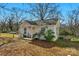 Charming home with a welcoming porch, bench, and a manicured front yard at 233 Proctor St, Gastonia, NC 28052