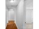 Hallway with wood floors, white walls, and doors leading to other rooms at 233 Proctor St, Gastonia, NC 28052