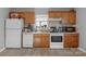 Charming kitchen equipped with matching appliances, wood cabinetry, and a window view at 233 Proctor St, Gastonia, NC 28052