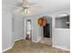 A kitchenette with wooden cabinets and black appliances with tile floors at 233 Proctor St, Gastonia, NC 28052