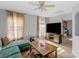 Cozy living room featuring a sofa, large windows, and a ceiling fan at 233 Proctor St, Gastonia, NC 28052