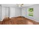 Inviting living room with a light color paint and herringbone floors, providing access to other rooms at 233 Proctor St, Gastonia, NC 28052