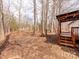 Spacious backyard featuring a wooden deck and mature trees at 236 Sailwinds Rd, Mooresville, NC 28115