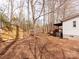 Wide open backyard with utility shed and wooden deck off of house at 236 Sailwinds Rd, Mooresville, NC 28115