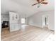 Open living space with modern light fixture near a spacious kitchen at 236 Sailwinds Rd, Mooresville, NC 28115