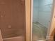 Bright bathroom showcasing a shower/tub combo and a walk-in closet at 2656 Polo Club Blvd, Matthews, NC 28105