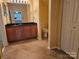 Full bathroom with double sink, granite countertop, wood cabinets, and toilet at 2656 Polo Club Blvd, Matthews, NC 28105