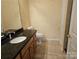 Well-maintained bathroom featuring granite countertops, vanity sink, toilet, and tiled floors at 2656 Polo Club Blvd, Matthews, NC 28105