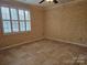 Bright bedroom with a large window, tiled flooring, and neutral paint, creating a cozy retreat at 2656 Polo Club Blvd, Matthews, NC 28105