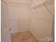 Walk-in closet with wire shelving, providing ample storage and organization for clothing and accessories at 2656 Polo Club Blvd, Matthews, NC 28105