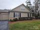 Charming single-story home with manicured lawn and neutral siding, showcasing curb appeal and a welcoming facade at 2656 Polo Club Blvd, Matthews, NC 28105