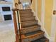 Elegant staircase with mosaic tile risers and decorative iron railing, adding a touch of sophistication at 2656 Polo Club Blvd, Matthews, NC 28105