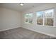 Bright bedroom featuring neutral walls, carpet, and double windows allowing for natural light at 268 Lytton Farm Rd, Troutman, NC 28166