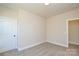 Simple bedroom with neutral carpet, base molding, and natural light from a window at 268 Lytton Farm Rd, Troutman, NC 28166