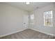 Bedroom with neutral walls, carpeted floor, and windows providing natural light at 268 Lytton Farm Rd, Troutman, NC 28166