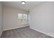 Cozy bedroom with neutral carpet and ample natural light from a large window at 268 Lytton Farm Rd, Troutman, NC 28166