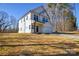 Charming two-story house featuring white siding, large windows, and a well-maintained lawn at 268 Lytton Farm Rd, Troutman, NC 28166