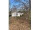 Single-story home with white siding set against a backdrop of trees at 282 Dixon Rd, Lancaster, SC 29720