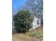 Single-story home with white siding and dark shutters surrounded by trees at 282 Dixon Rd, Lancaster, SC 29720