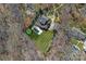Aerial view of the expansive property featuring a lush lawn, swimming pool, and circular driveway at 3212 Lazy Branch Rd, Charlotte, NC 28270