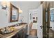 Elegant bathroom with a marble countertop vanity, modern fixtures, and an open doorway to the game room at 3212 Lazy Branch Rd, Charlotte, NC 28270