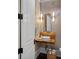 Stylish powder room features a live edge wood counter and vessel sink at 3212 Lazy Branch Rd, Charlotte, NC 28270