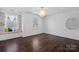 Bright bedroom with hardwood floors, large windows, and a cozy window seat with storage at 3212 Lazy Branch Rd, Charlotte, NC 28270