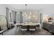 Elegant dining room with unique light fixture and statement artwork at 3212 Lazy Branch Rd, Charlotte, NC 28270