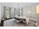 Bright dining room with modern chandelier, decorative wall art, and luxury oval table at 3212 Lazy Branch Rd, Charlotte, NC 28270
