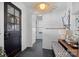 Elegant entryway with a dark door, geometric floor tiles, and stylish light fixture at 3212 Lazy Branch Rd, Charlotte, NC 28270