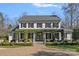 Stunning two-story white brick home featuring black shutters and inviting front porch with brick pavers at 3212 Lazy Branch Rd, Charlotte, NC 28270
