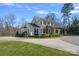 Charming two-story home with manicured lawn and inviting front porch featuring decorative shrubbery at 3212 Lazy Branch Rd, Charlotte, NC 28270
