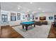 Spacious game room with a pool table, media center, and sports memorabilia for entertaining and relaxation at 3212 Lazy Branch Rd, Charlotte, NC 28270