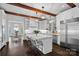 Spacious white kitchen with a large island, stainless steel appliances, and hardwood floors at 3212 Lazy Branch Rd, Charlotte, NC 28270