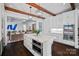 Modern white kitchen with a marble island, stainless steel appliances, and hardwood floors at 3212 Lazy Branch Rd, Charlotte, NC 28270