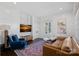 Modern living room with stylish furniture, hardwood floors, and natural light at 3212 Lazy Branch Rd, Charlotte, NC 28270