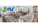 Bright living room featuring modern art, stylish furniture, and a striking geometric rug at 3212 Lazy Branch Rd, Charlotte, NC 28270