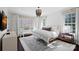 Bright main bedroom with large windows, neutral tones, and elegant chandelier at 3212 Lazy Branch Rd, Charlotte, NC 28270