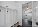 Bright mudroom features custom lockers with coat hooks, bench, and overhead storage cabinets at 3212 Lazy Branch Rd, Charlotte, NC 28270