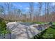 Large pool with a meticulously landscaped yard, lounge chairs, and wooden fence providing a private oasis at 3212 Lazy Branch Rd, Charlotte, NC 28270