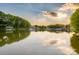Scenic lake view featuring the calm water with boat docks surrounded by trees and various homes at 324 Bridgewater Ln, Mooresville, NC 28117