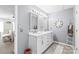 Bright bathroom featuring double sinks, tile floors, and modern fixtures at 3929 Wexford Ln, Denver, NC 28037