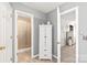 Hallway bathroom with a walk-in shower, and a white cabinet at 3929 Wexford Ln, Denver, NC 28037