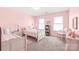 Pink bedroom with two twin beds, natural light, and neutral carpet at 3929 Wexford Ln, Denver, NC 28037