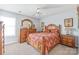 Bedroom with tropical decor, a ceiling fan, and neutral carpet at 3929 Wexford Ln, Denver, NC 28037